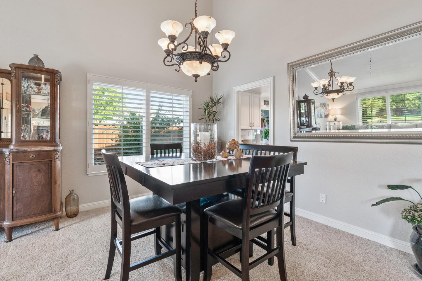 42 Seneca Lane San Ramon, CA 94583 - Photo 5 of 40 a view of a dining room with furniture a chandelier and wooden floor