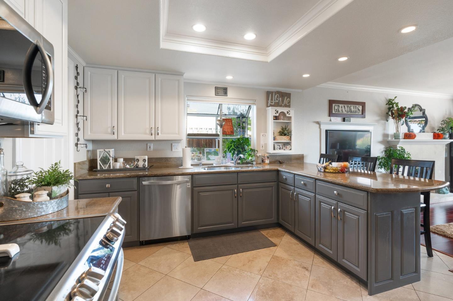 42 Seneca Lane San Ramon, CA 94583 - Photo 7 of 40 a kitchen with stainless steel appliances granite countertop sink stove and microwave