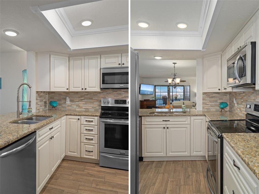 8211 Brent Street, Unit 847 Port Richey, FL 34668 - Photo 12 of 29 a kitchen with kitchen island granite countertop a sink cabinets and stainless steel appliances