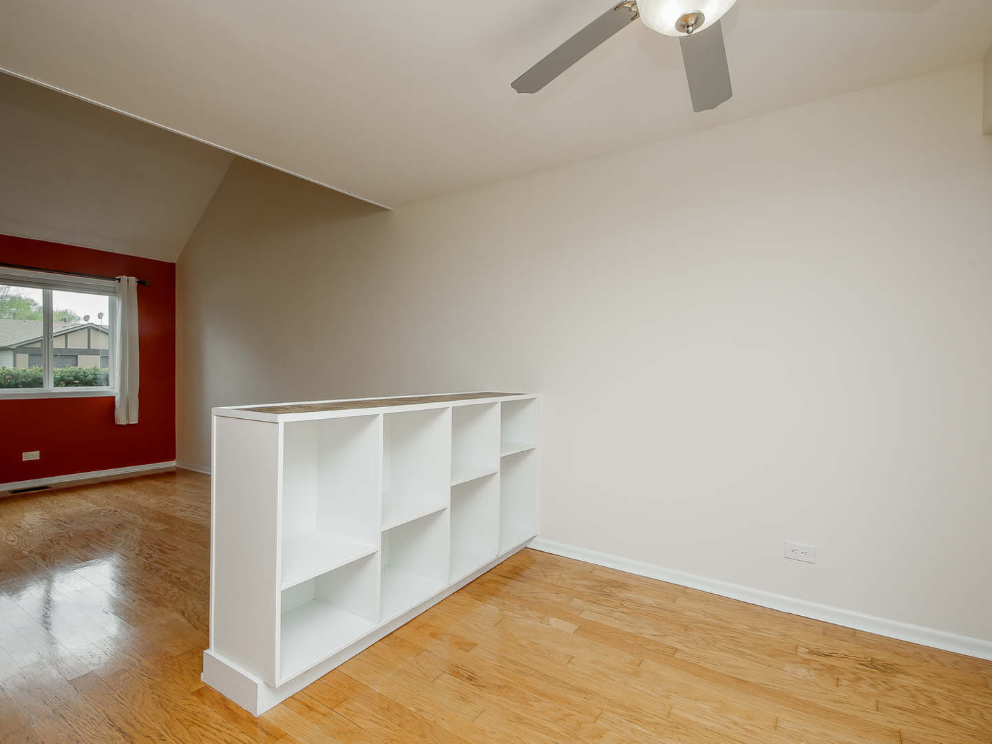 3320 Fox Hill Road Aurora, IL 60504 - Photo 5 of 10 a view of an empty room with wooden floor and a window