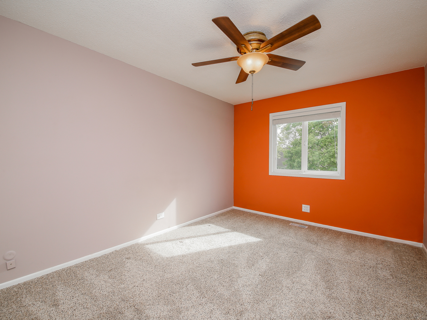 3320 Fox Hill Road Aurora, IL 60504 - Photo 7 of 10 an empty room with window and ceiling fan