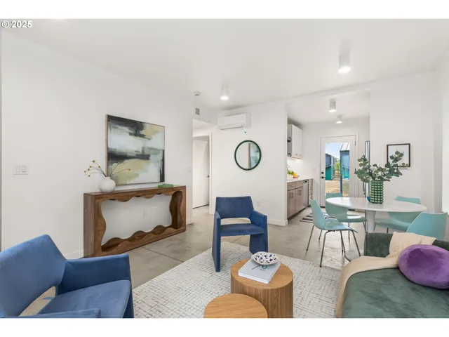 a living room with furniture and a table