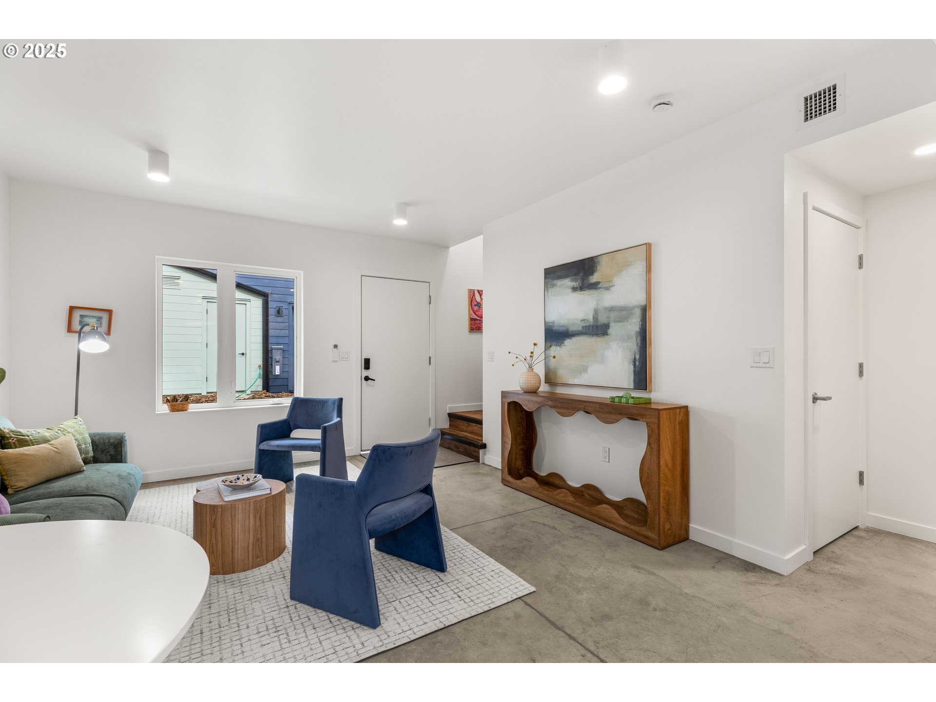 9947 Southeast Cottage Lane, Unit 3 Milwaukie, OR 97222 - Photo 19 of 38 a living room with furniture and a wooden floor