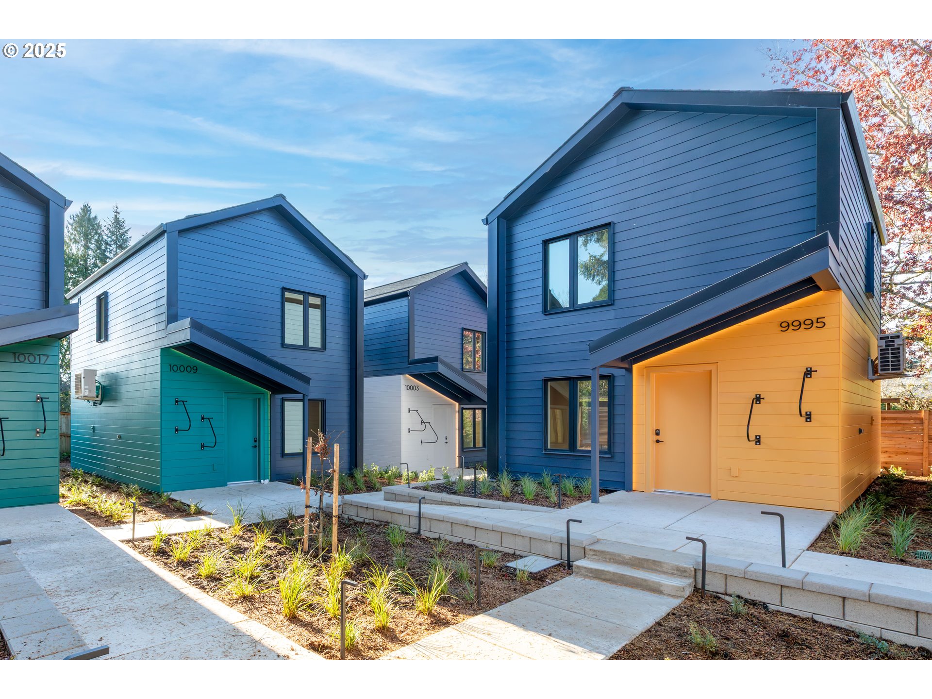 9947 Southeast Cottage Lane, Unit 3 Milwaukie, OR 97222 - Photo 25 of 38 a view of a house with a swimming pool