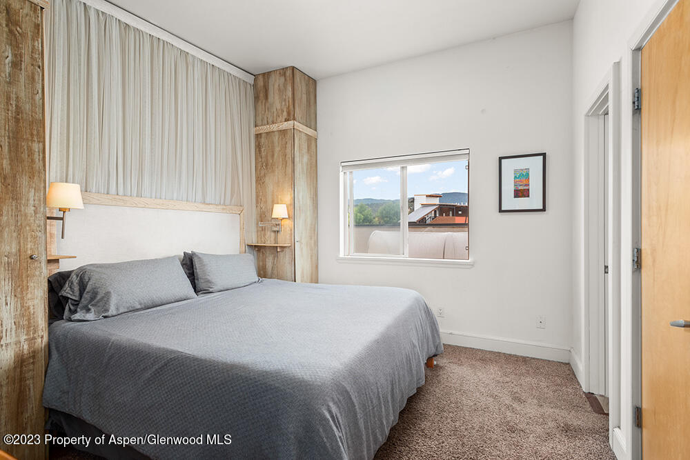 2563 Dolores Way Carbondale, CO 81623 - Photo 7 of 12 a bedroom with a bed and a window