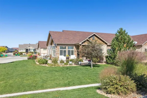 a view of house with a yard
