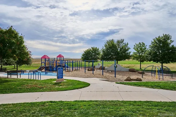 a view of a park with swings and slides