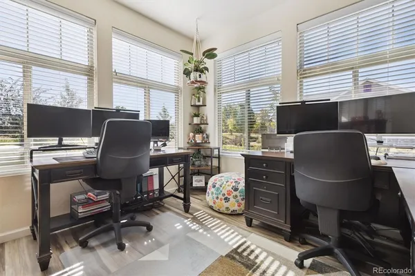 a workspace with furniture and a window