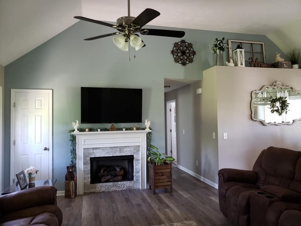 5771 Payne Road Portland, TN 37148 - Photo 4 of 11 a living room with furniture fireplace and flat screen tv