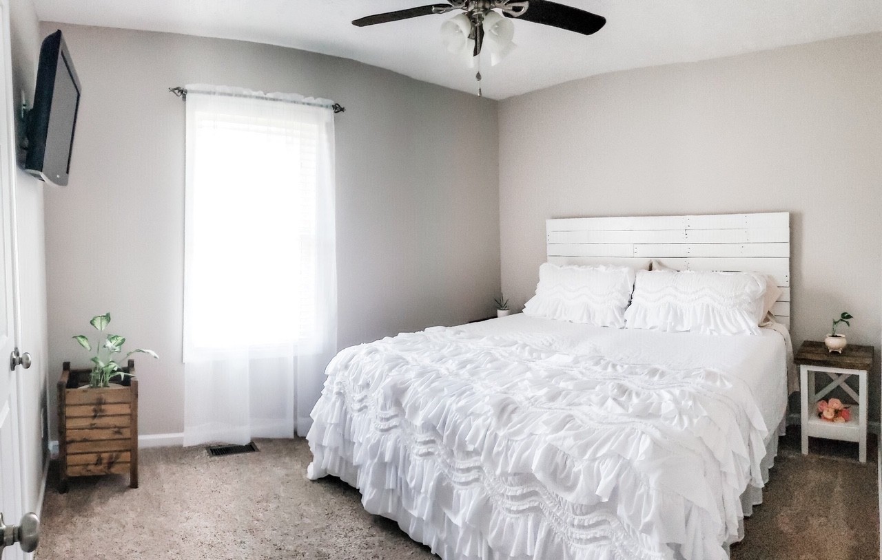 5771 Payne Road Portland, TN 37148 - Photo 8 of 11 a bedroom with a bed and a ceiling fan