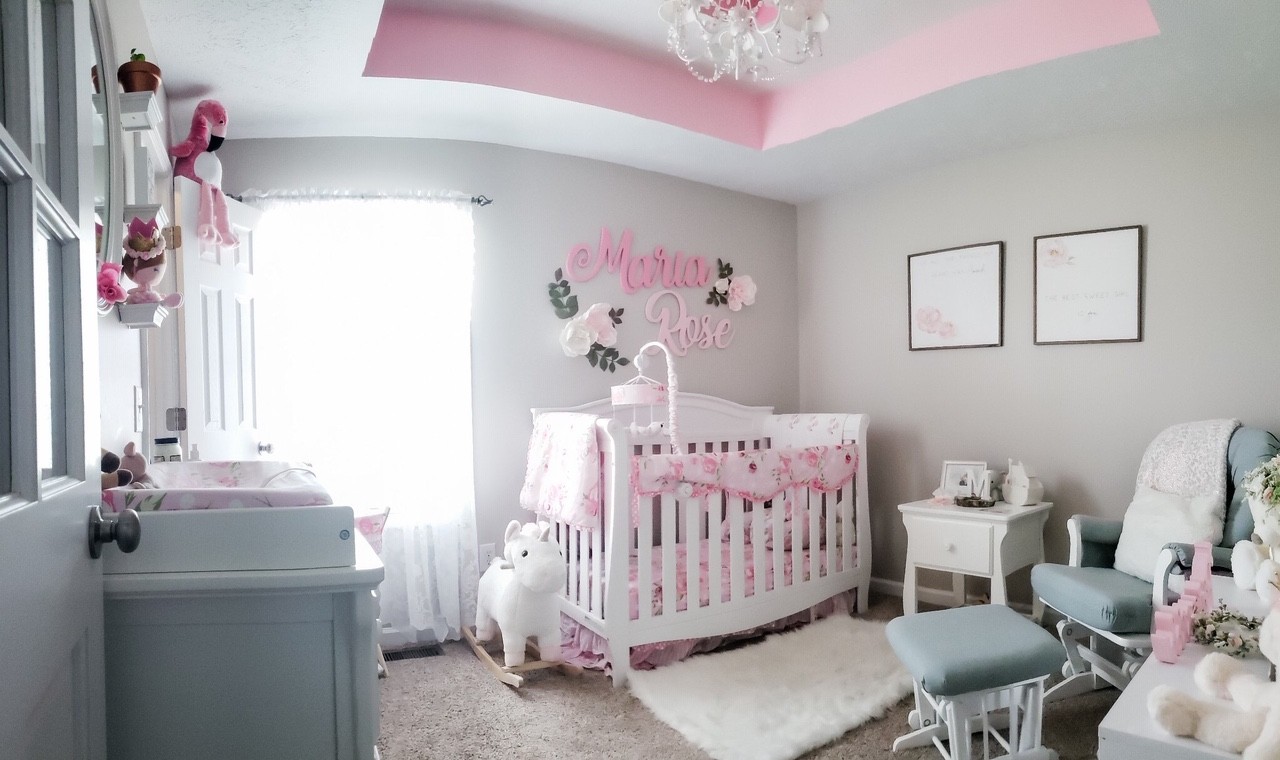 5771 Payne Road Portland, TN 37148 - Photo 9 of 11 a bedroom with a bed and a chandelier