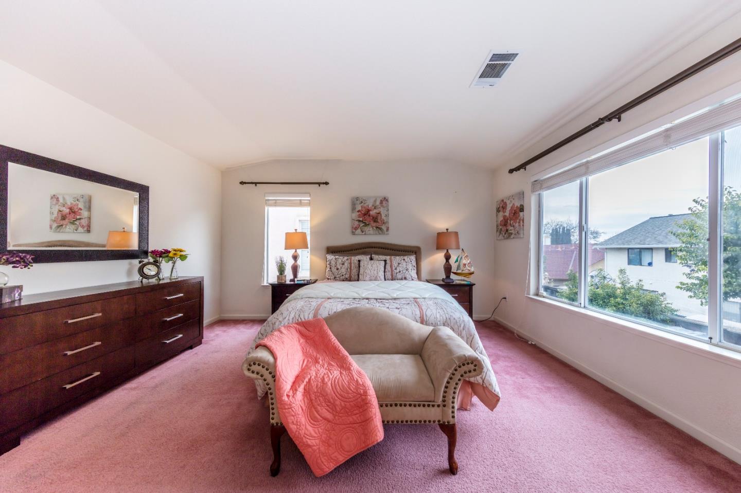 2235 Woodranch Road San Jose, CA 95131 - Photo 20 of 40 a bedroom with a bed and a dresser next to a window