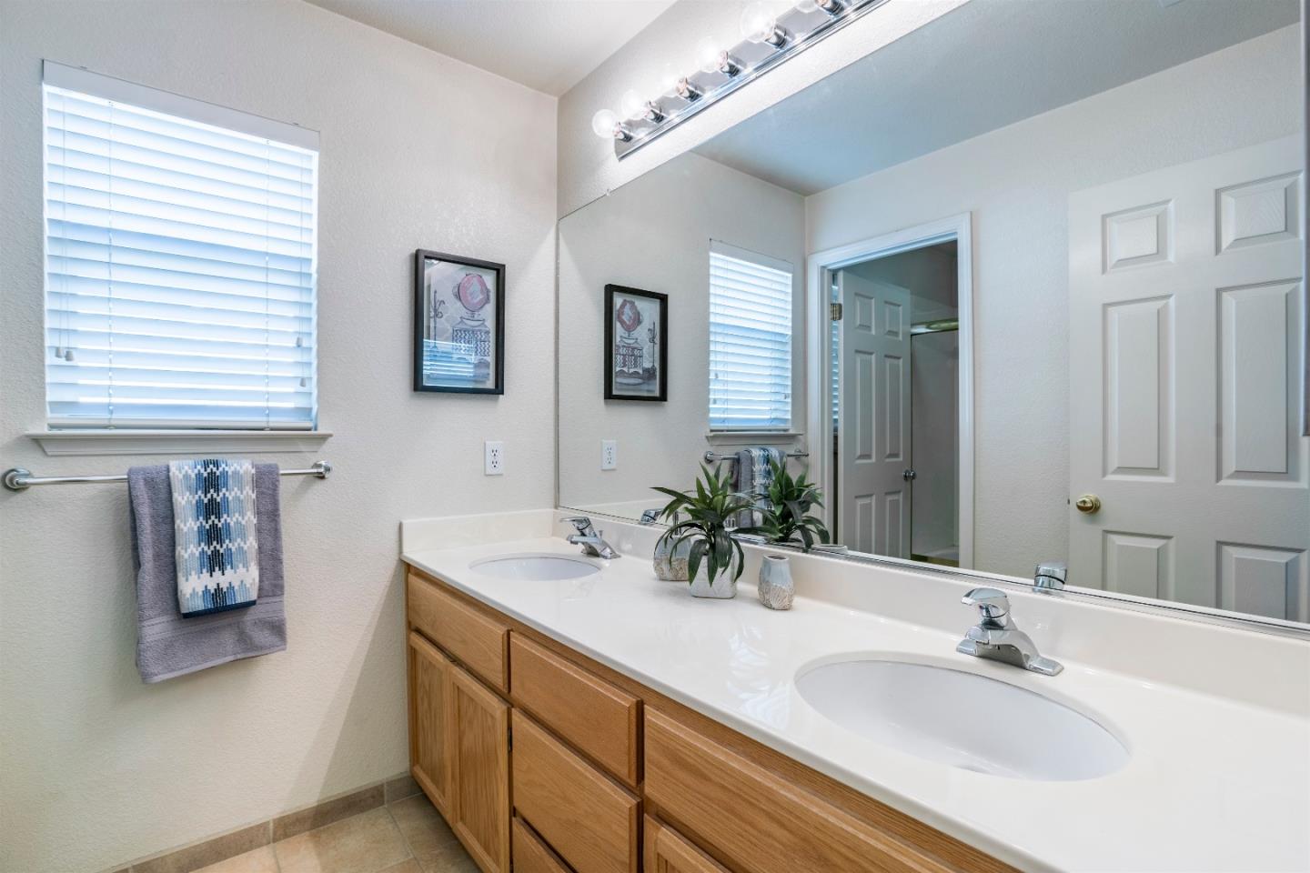 2235 Woodranch Road San Jose, CA 95131 - Photo 37 of 40 a bathroom with a sink and a mirror