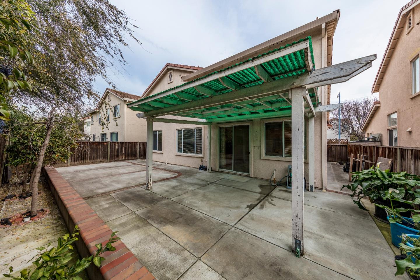 2235 Woodranch Road San Jose, CA 95131 - Photo 39 of 40 a view of house with backyard and outdoor seating