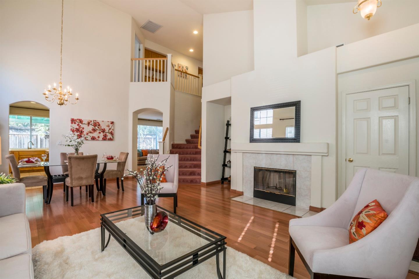 2235 Woodranch Road San Jose, CA 95131 - Photo 5 of 40 a living room with furniture fireplace and dining table