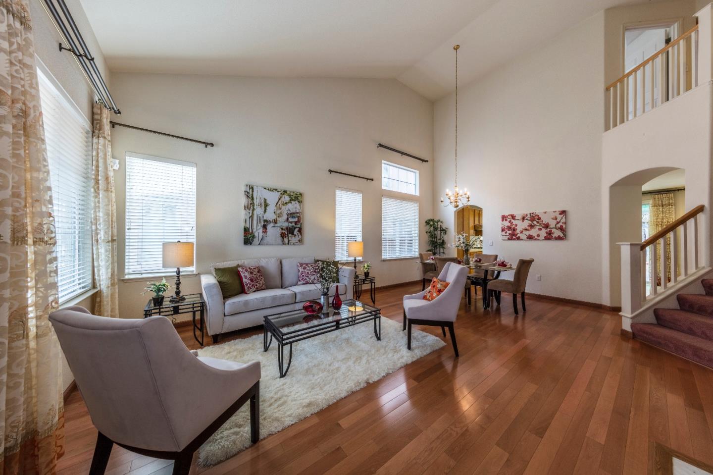 2235 Woodranch Road San Jose, CA 95131 - Photo 6 of 40 a living room with furniture two window and a wooden floor