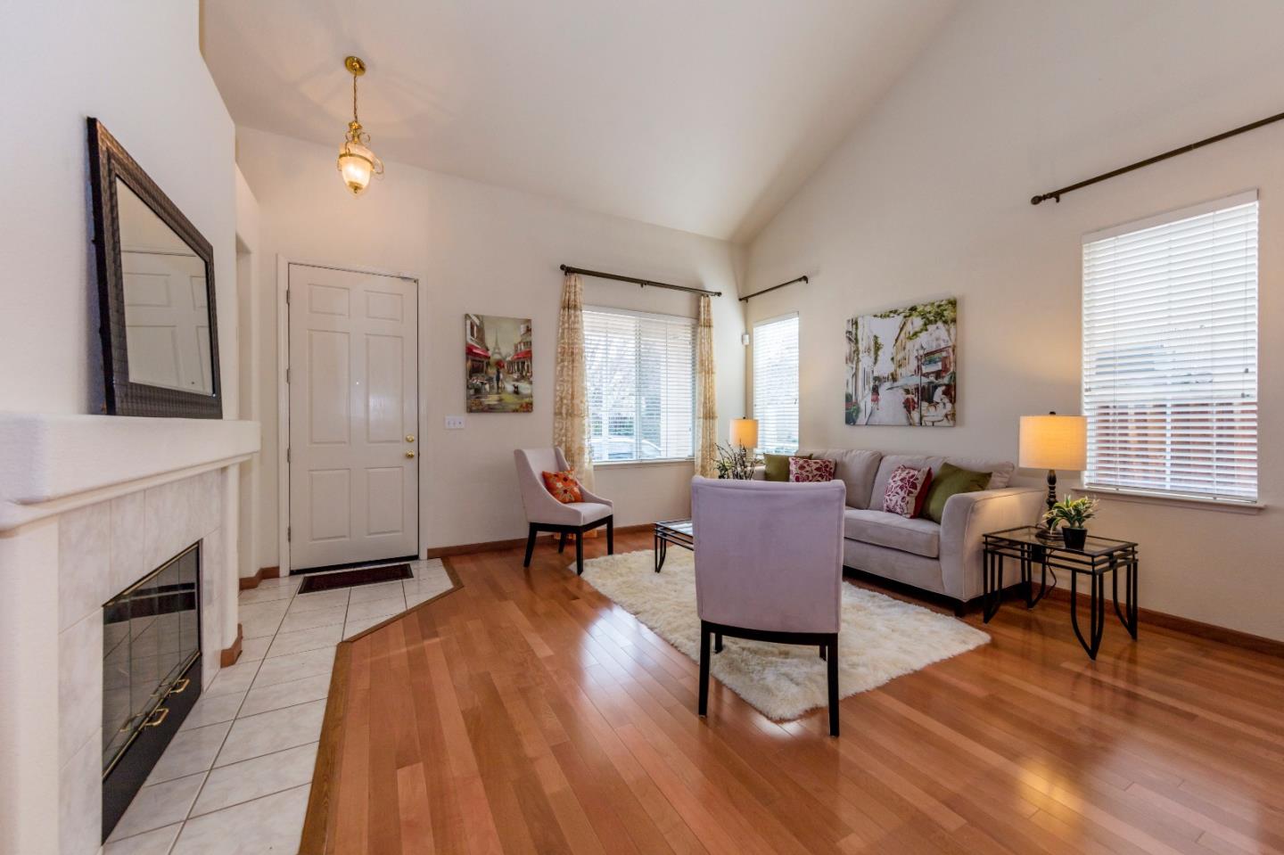 2235 Woodranch Road San Jose, CA 95131 - Photo 8 of 40 a living room with furniture a fireplace and a window