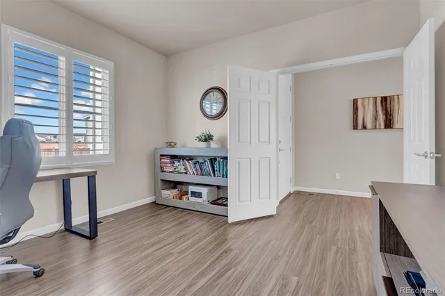 a view of a livingroom with furniture and wooden floor