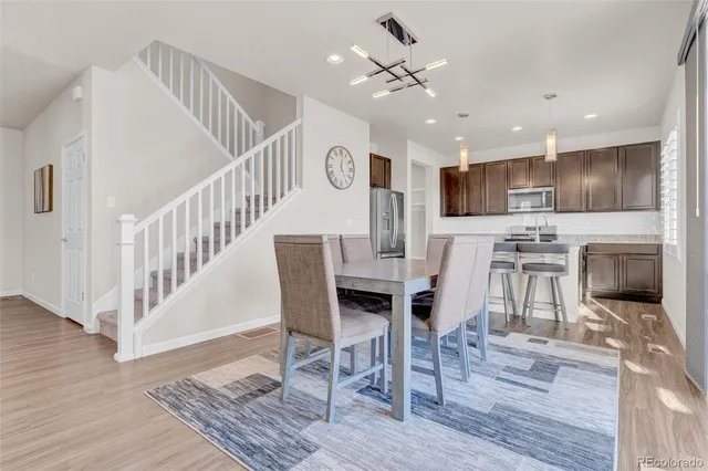 a view of kitchen with cabinets and wooden floor