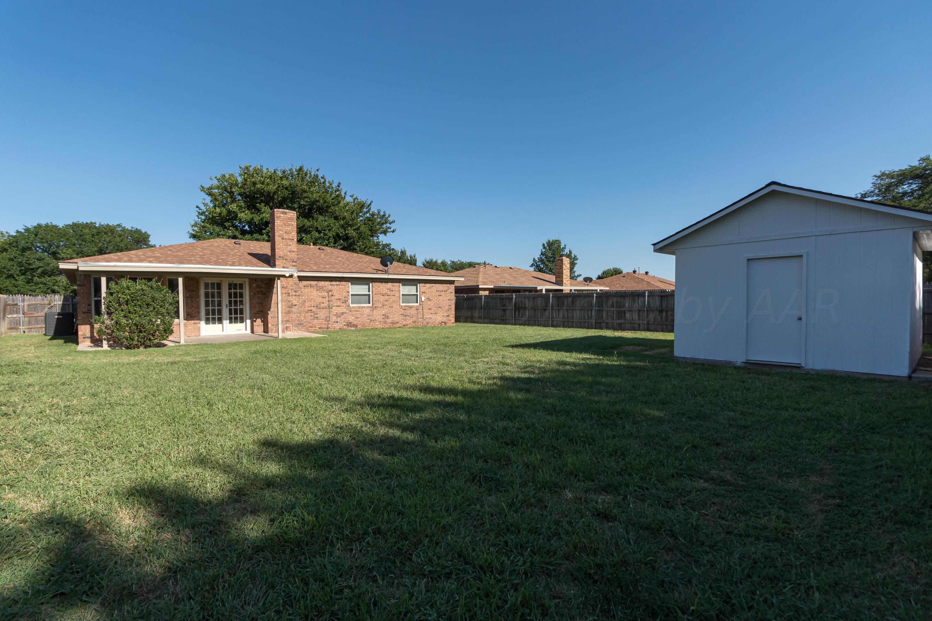 8204 Santa Fe Trail Amarillo, TX 79110 - Photo 12 of 13 a house view with a garden space