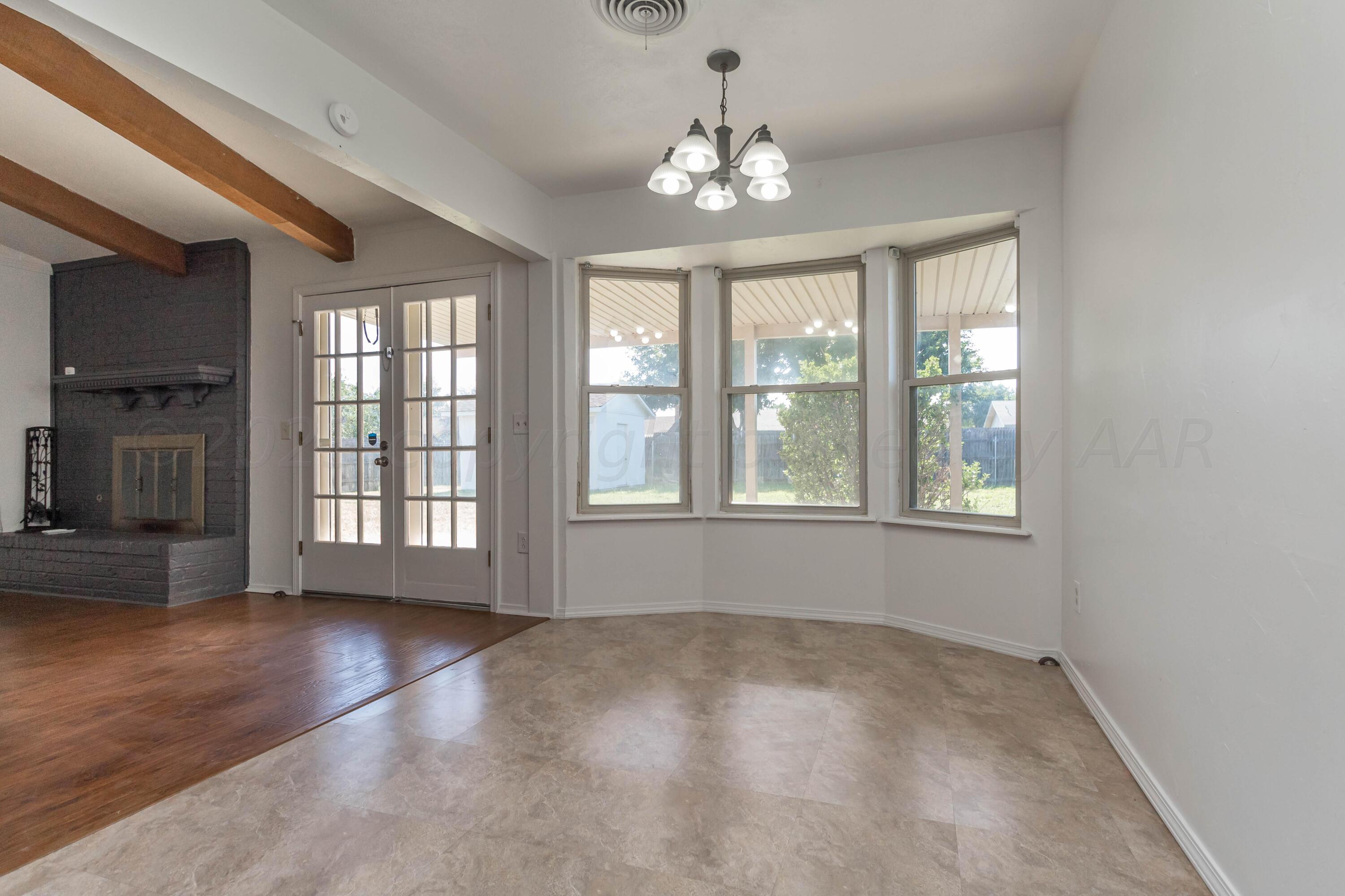 8204 Santa Fe Trail Amarillo, TX 79110 - Photo 6 of 13 a view of an empty room with a window