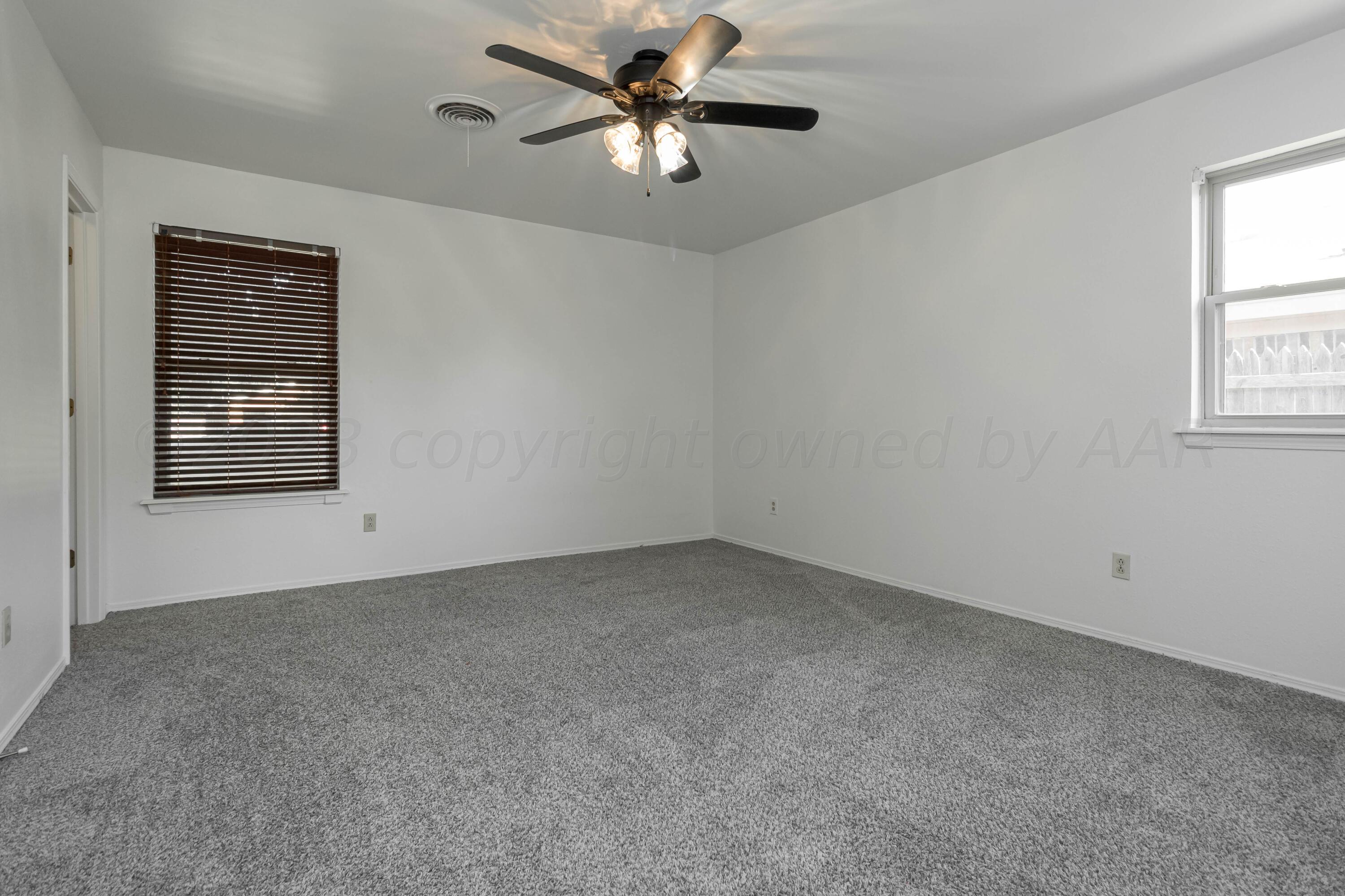 8204 Santa Fe Trail Amarillo, TX 79110 - Photo 7 of 13 a view of an empty room with a window