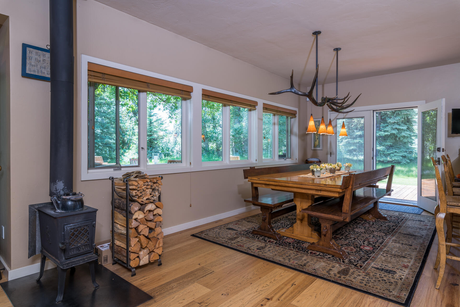102 Willow Road Blaine County, ID 83333 - Photo 9 of 38 Wood stove by dining table