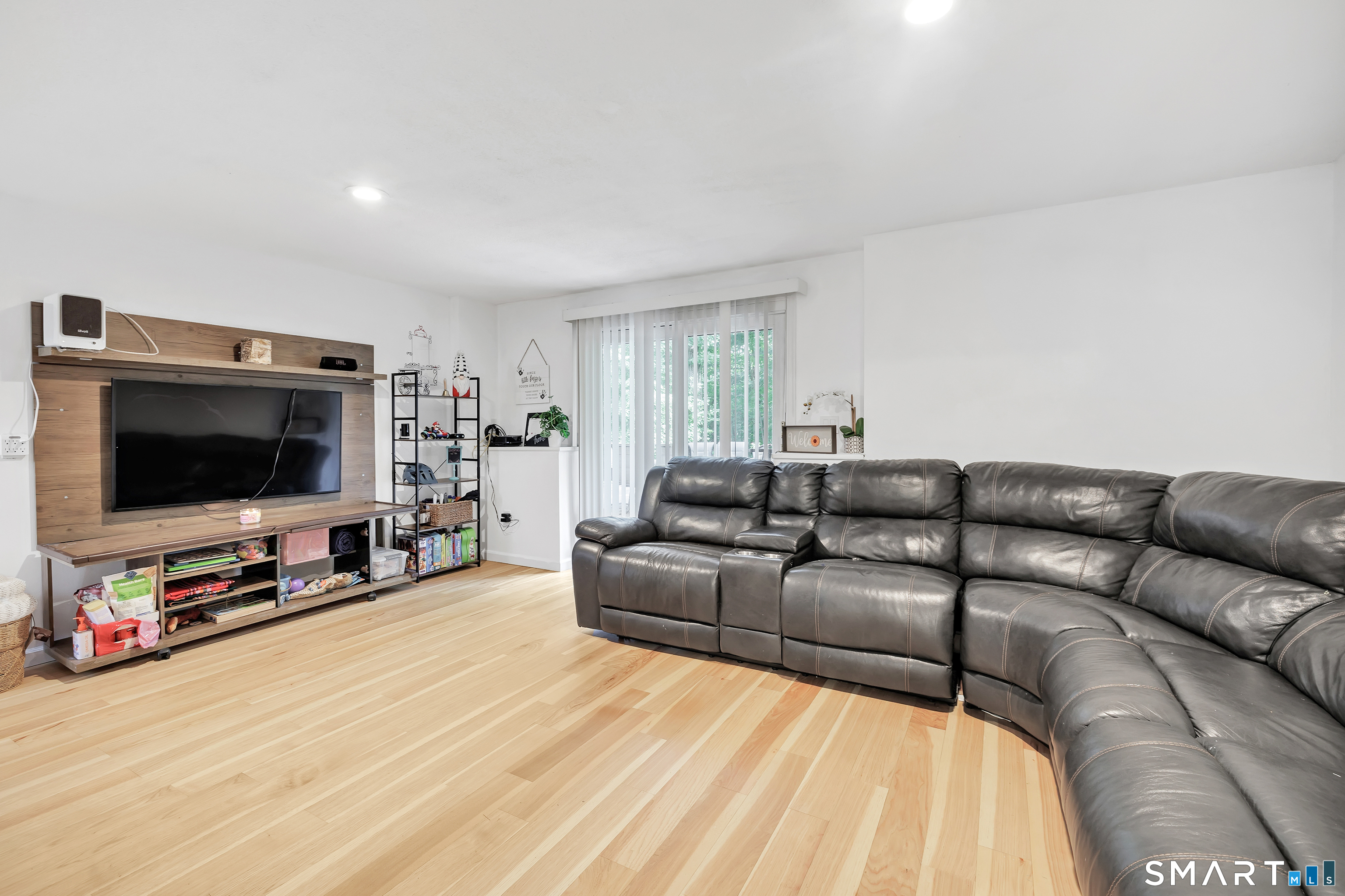 110 Bart Road Monroe, CT 06468 - Photo 22 of 35 Located in the lower level the family room walks out to the backyard patio area.