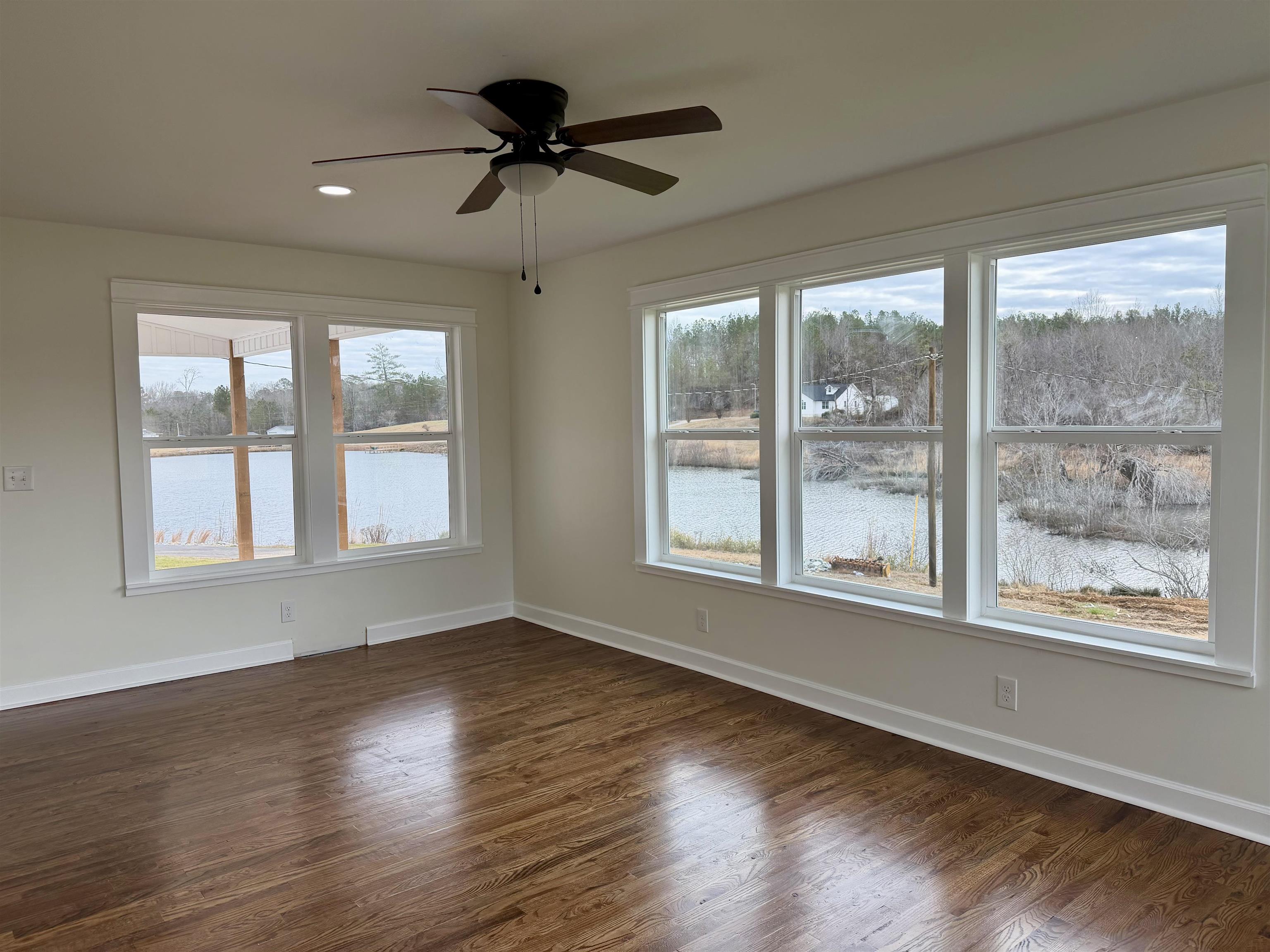 172 New Bethel Road Selmer, TN 38375 - Photo 19 of 30 a view of an empty room with wooden floor and a window