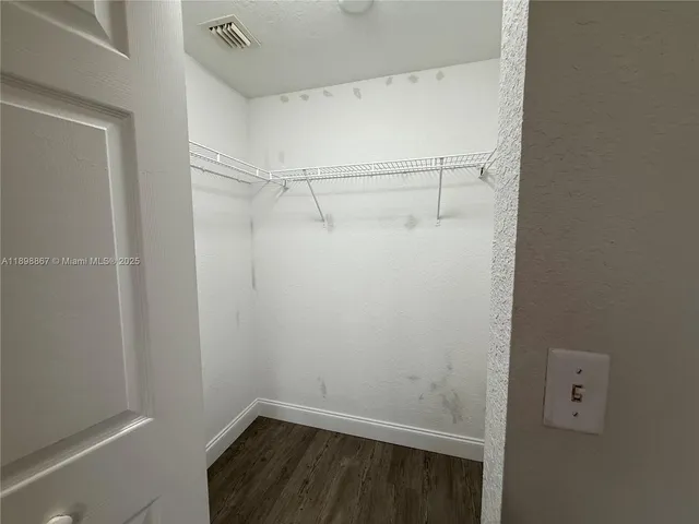 a view of a room with racks on the wall