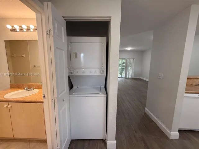 a view of hallway with washer and dryer
