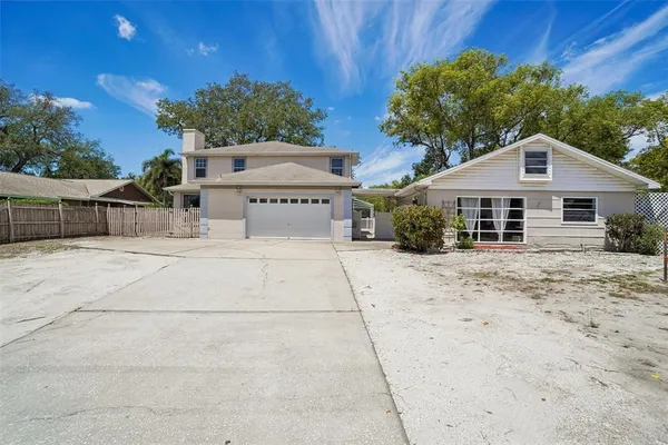 a house with trees in the background