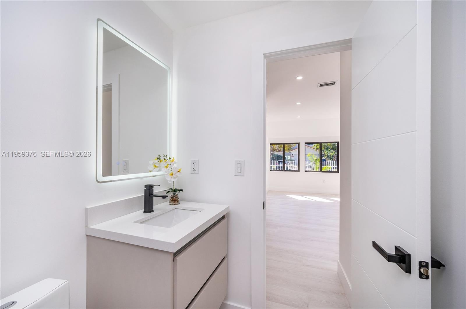 2363 Southwest 11th Terrace Miami, FL 33135 - Photo 18 of 49 a bathroom with a sink and a mirror