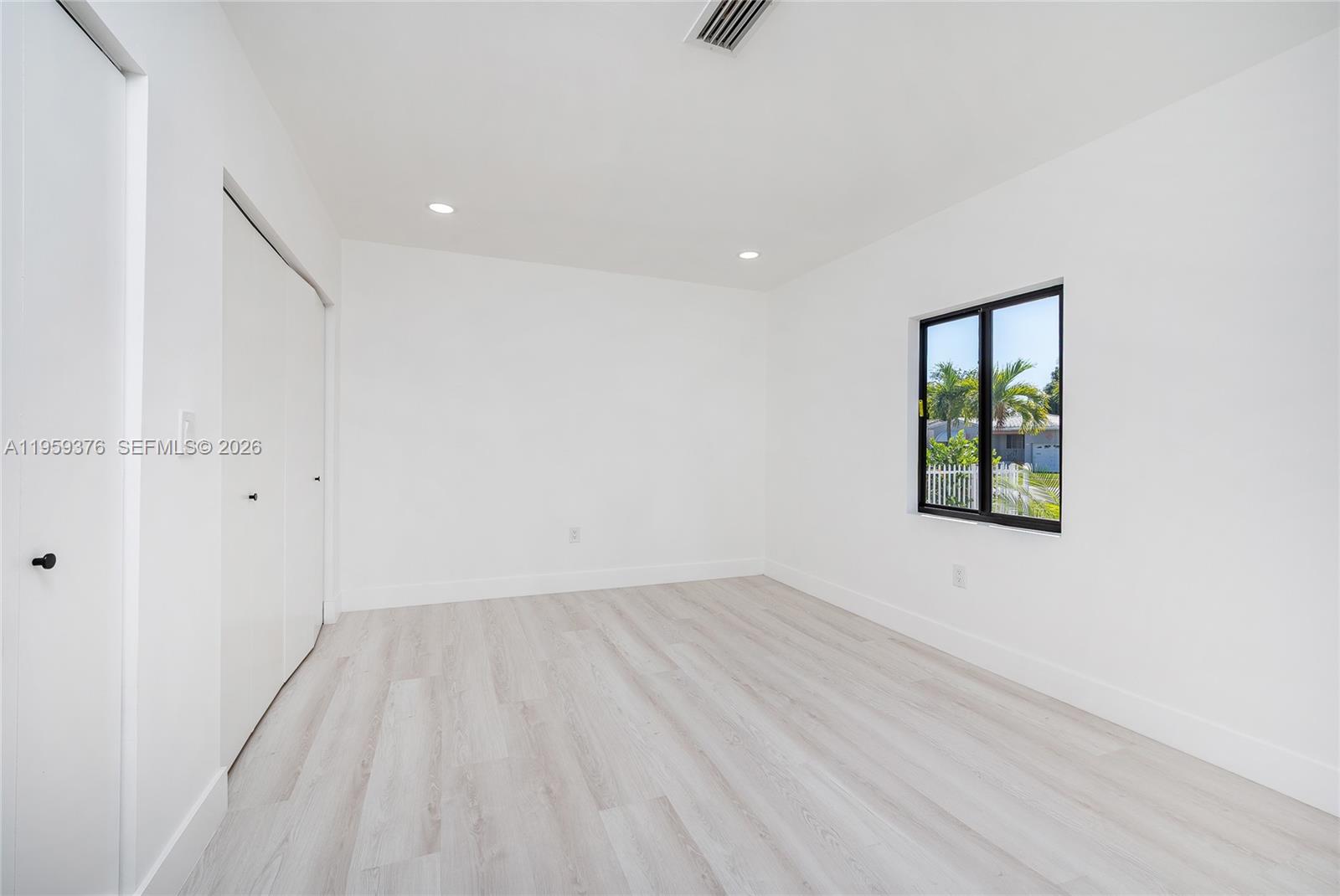 2363 Southwest 11th Terrace Miami, FL 33135 - Photo 20 of 49 an empty room with a window