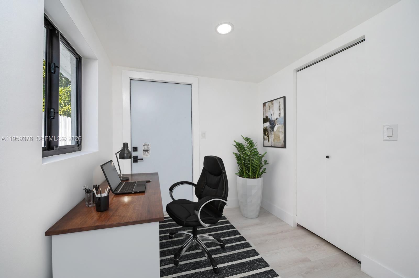 2363 Southwest 11th Terrace Miami, FL 33135 - Photo 23 of 49 a workspace with furniture and window