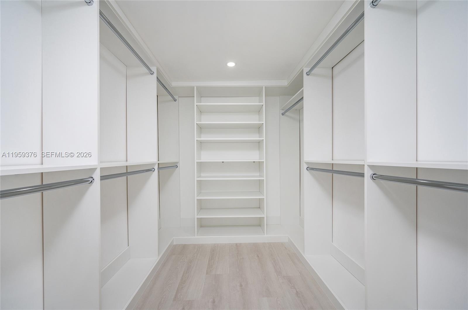 2363 Southwest 11th Terrace Miami, FL 33135 - Photo 27 of 49 a view of walk in closet with empty racks