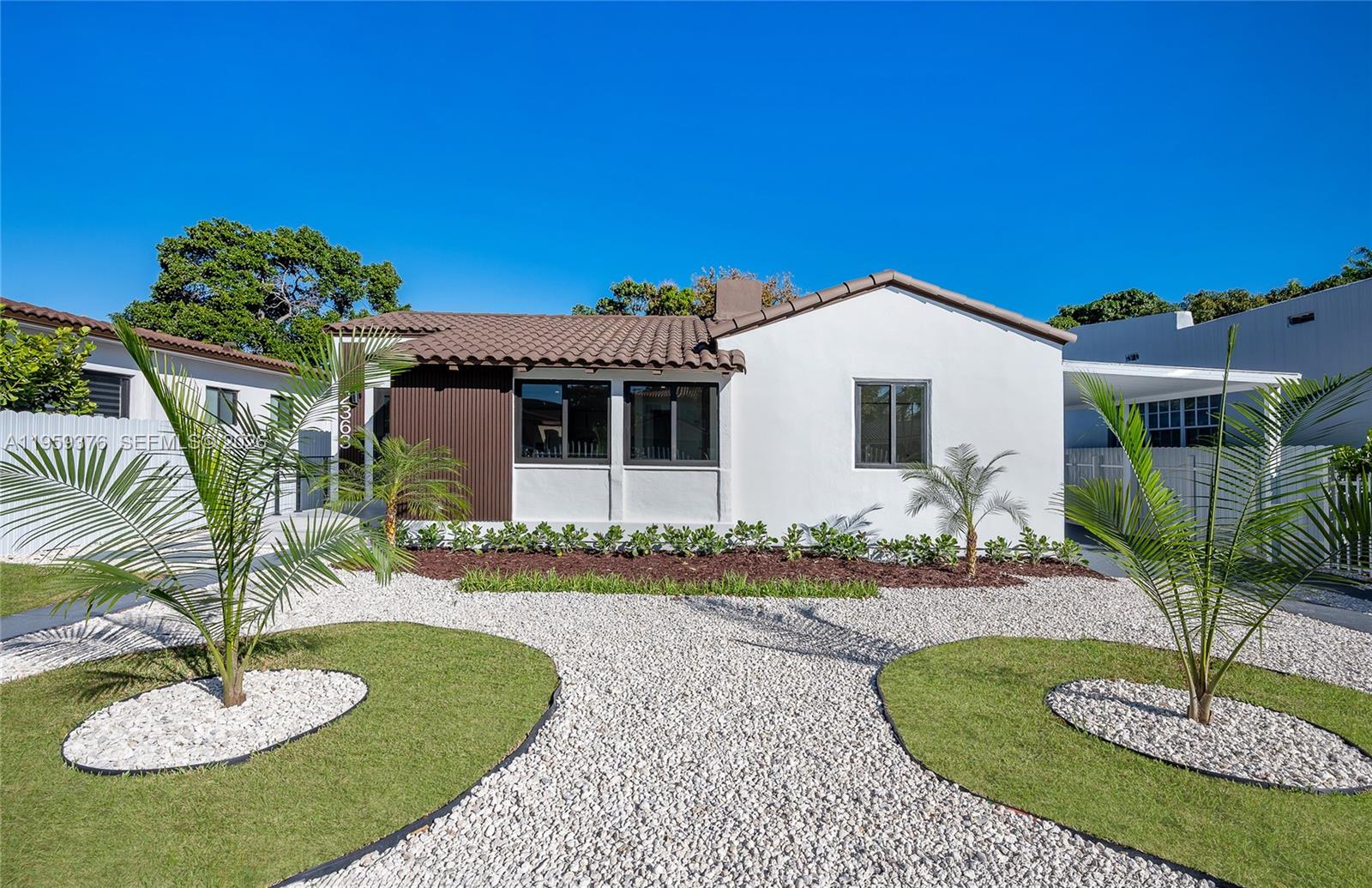 2363 Southwest 11th Terrace Miami, FL 33135 - Photo 3 of 49 a front view of a house with a yard