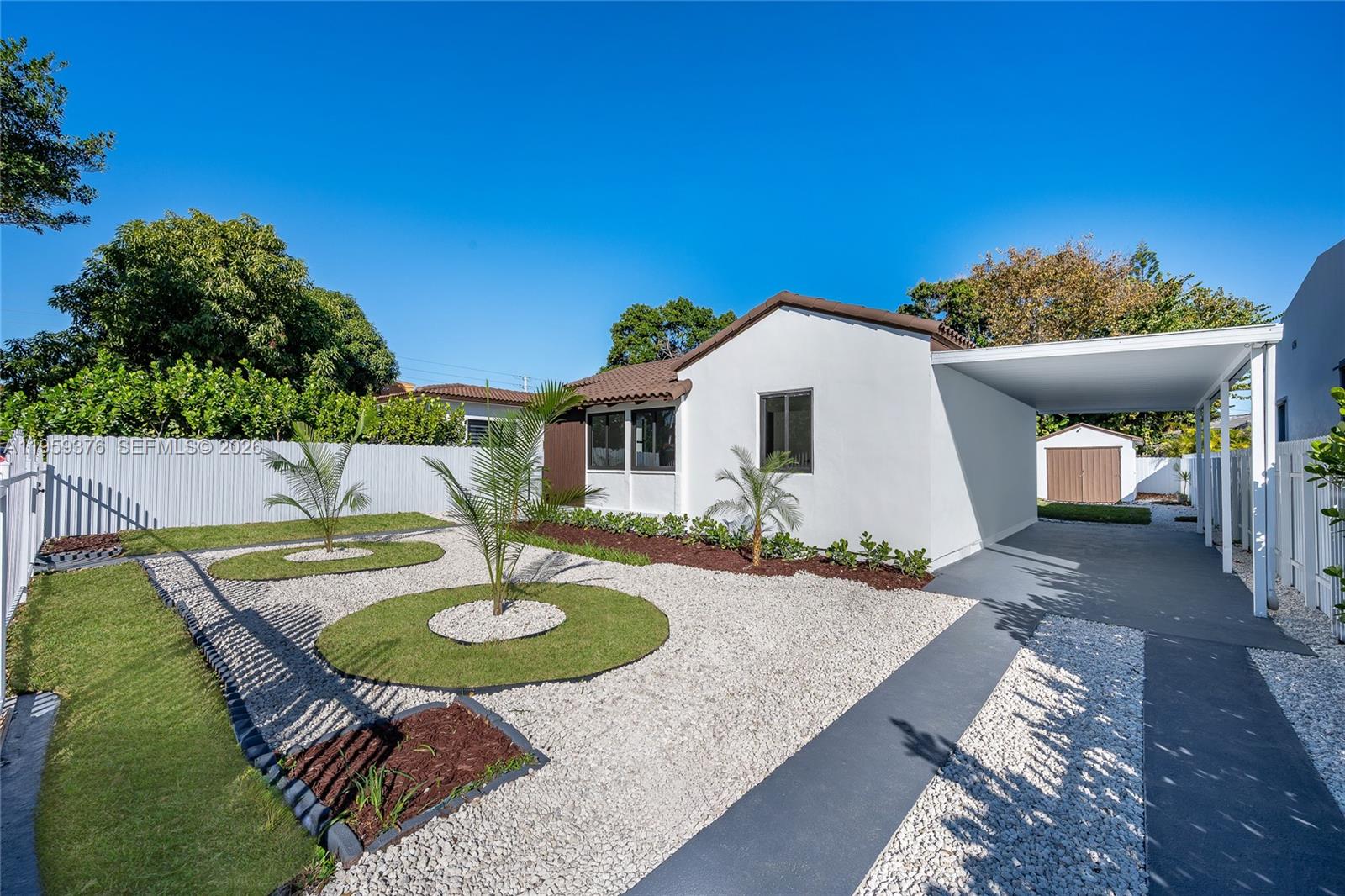 2363 Southwest 11th Terrace Miami, FL 33135 - Photo 4 of 49 a view of a house with backyard and a patio