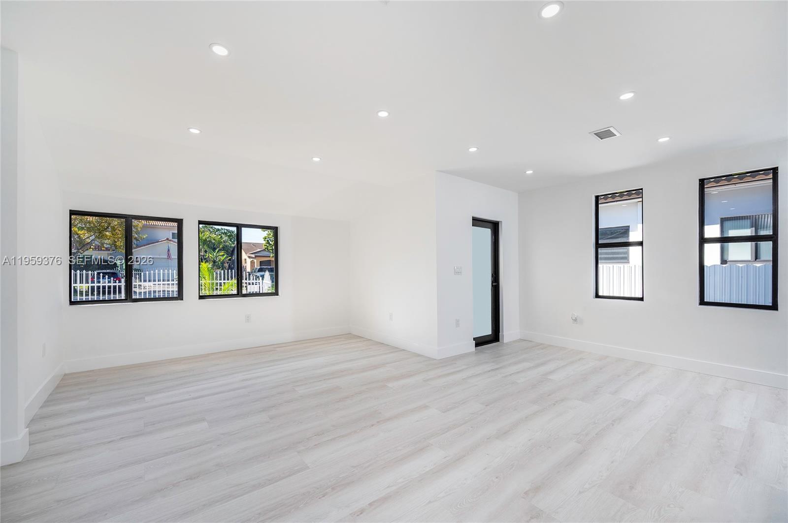 2363 Southwest 11th Terrace Miami, FL 33135 - Photo 7 of 49 a view of an empty room with a window