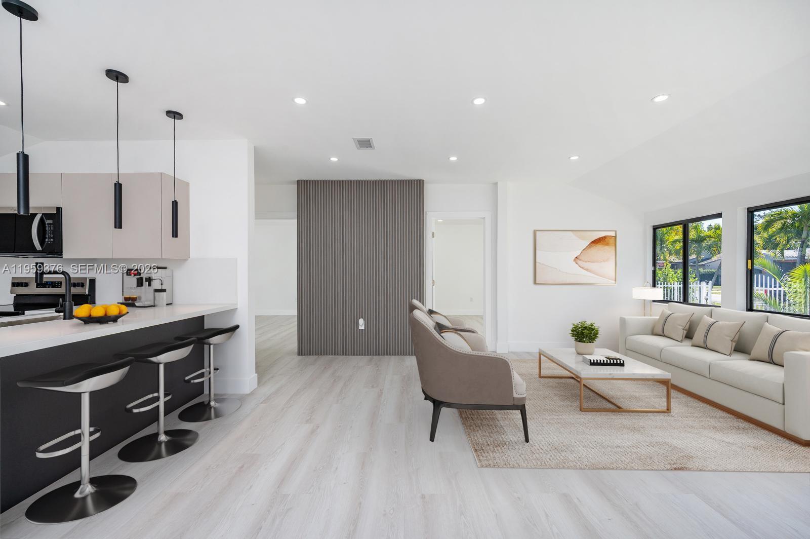 2363 Southwest 11th Terrace Miami, FL 33135 - Photo 8 of 49 a living room with furniture and a flat screen tv