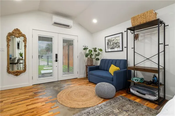 a living room with furniture and a gate