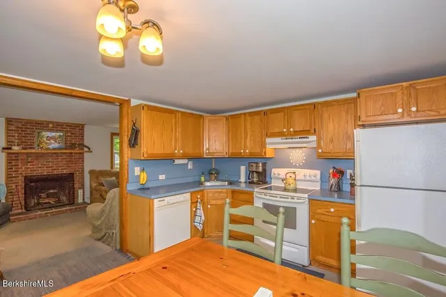 a kitchen with a stove and a refrigerator