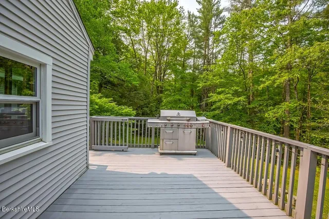 a view of a balcony with wooden floor