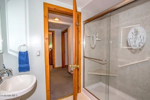 a bathroom with a tub and shower