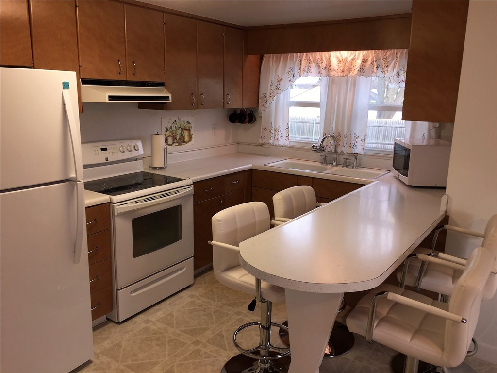 5 Ruth Street Middletown, RI 02842 - Photo 5 of 26 Kitchen with breakfast bar and dining area.