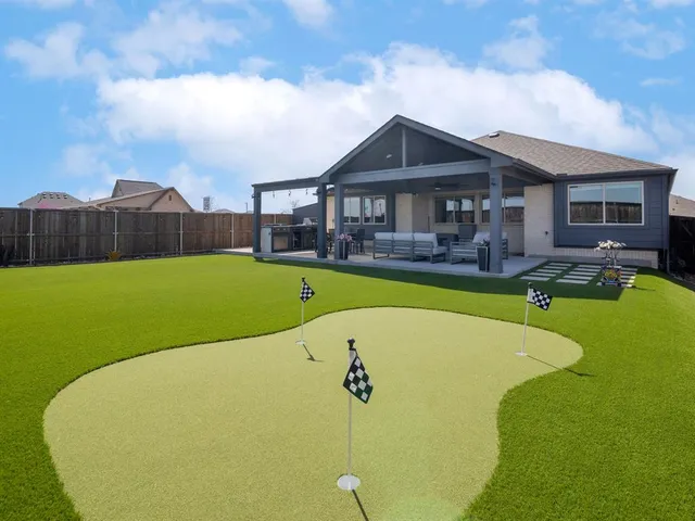 a view of a house with a big yard