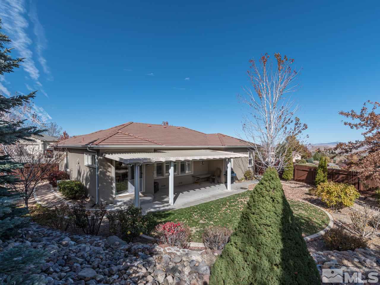 5837 North White Sands Road Reno, NV 89511 - Photo 20 of 22 a view of a house with a yard