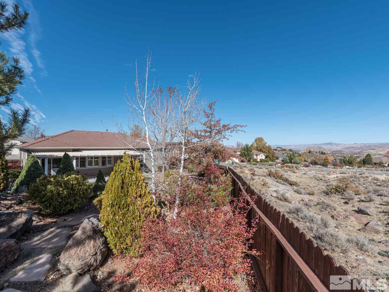 5837 North White Sands Road Reno, NV 89511 - Photo 21 of 22 a view of a terrace with a garden