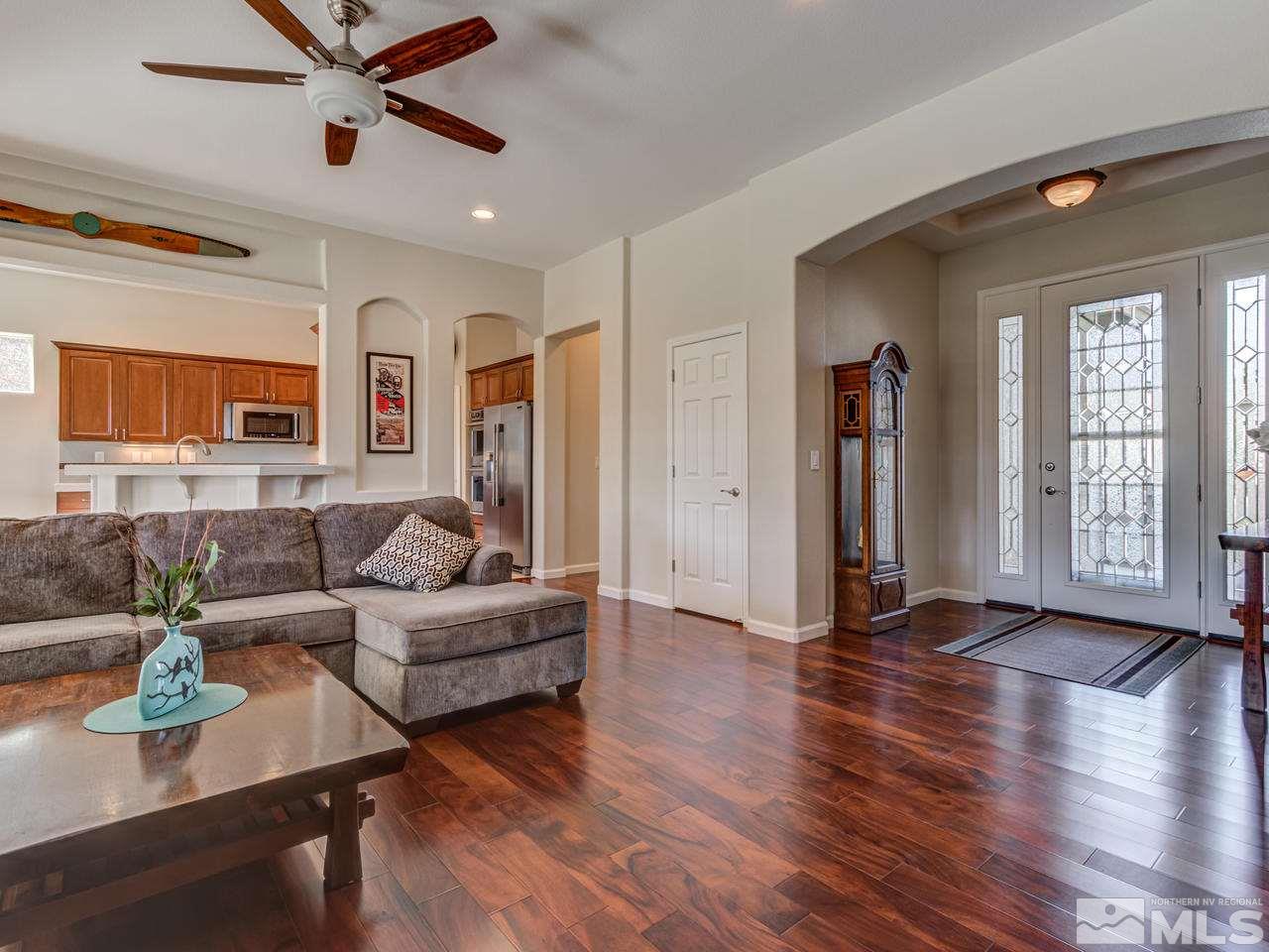 5837 North White Sands Road Reno, NV 89511 - Photo 4 of 22 a living room with furniture and wooden floor