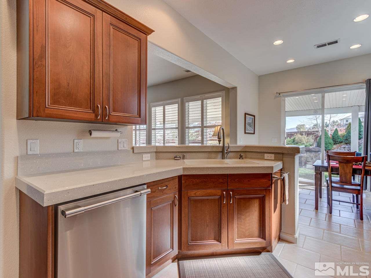 5837 North White Sands Road Reno, NV 89511 - Photo 8 of 22 a kitchen with a sink and cabinets